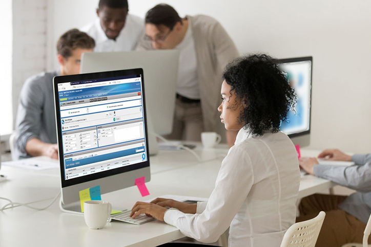 Woman looking at her desktop screen